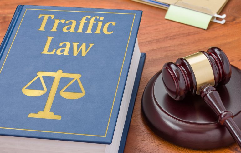 A law book with a gavel  - Traffic law